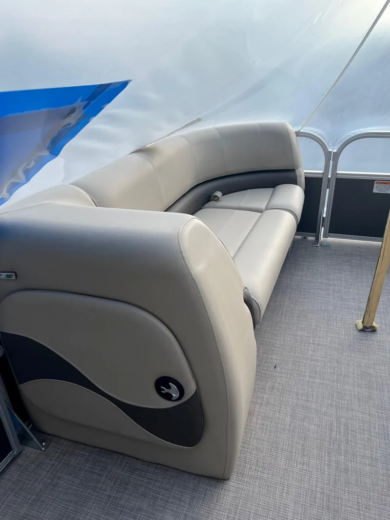 Slide: The Image of 2024 Sun Tracker Party Barge 18 DLX interior seating, featuring plush, curved upholstery. - 3
