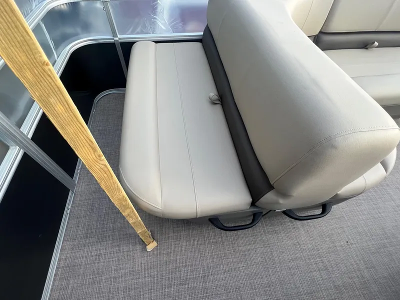 Slide: The Image of 2024 Sun Tracker Party Barge 18 DLX interior seating with beige upholstery. - 4