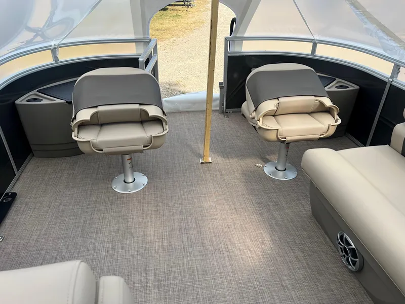 Slide: The Image of 2024 Sun Tracker Fishin' Barge 20 DLX interior with comfortable seating and spacious layout. - 3