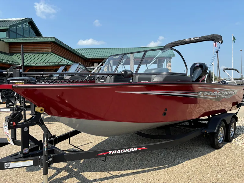 The Image of 2024 Tracker Targa V-18 WT boat in red on trailer, outdoor display. - 0