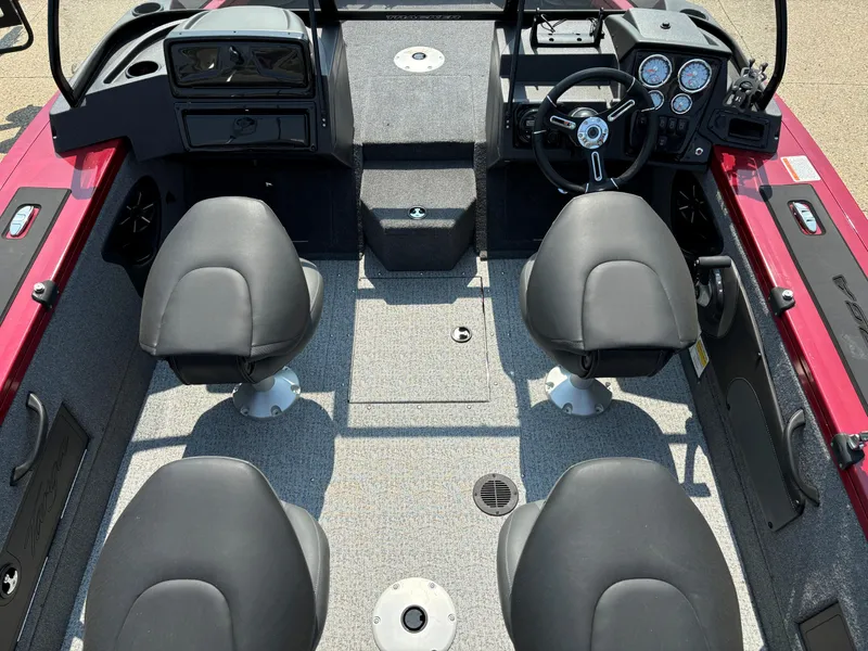 Slide: The Image of 2024 Tracker Targa V-18 WT boat interior with four seats and steering console. - 4