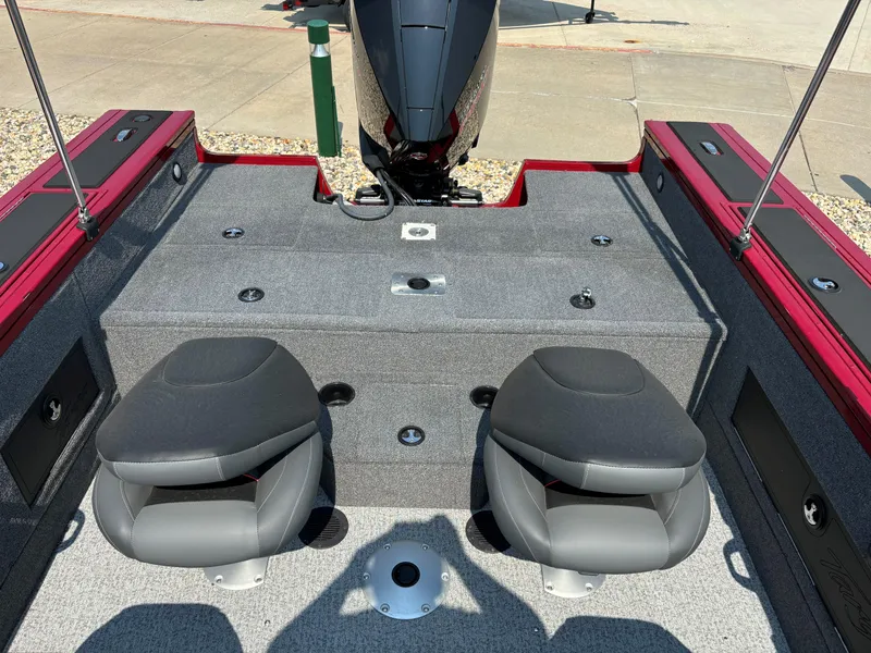 Slide: The Image of 2024 Tracker Targa V-18 WT boat interior with two seats and motor. - 5