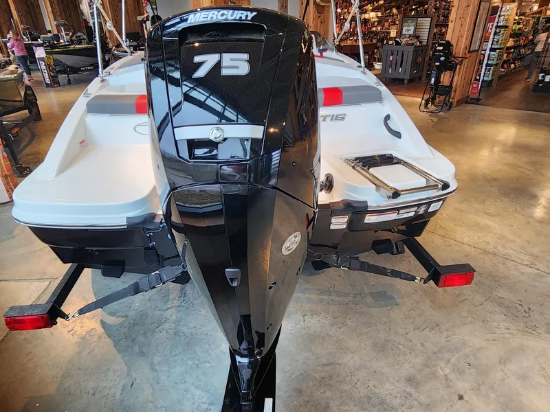 Slide: The Image of 2024 Tahoe T16 boat with Mercury 75 engine displayed indoors. - 3