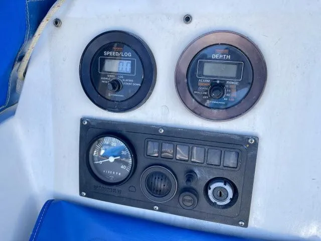 Slide: The Image of Control panel of a 1973 Ericson 27 sailboat with speed, depth, and gauge instruments. - 11