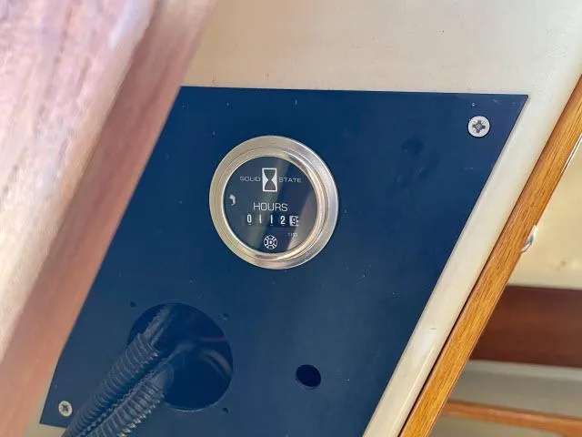 Slide: The Image of Hour meter on a 1973 Ericson 27 sailboat showing 1126 hours. - 14