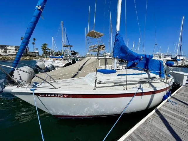 Slide: The Image of 1973 Ericson 27 sailboat docked at marina on a sunny day. - 16