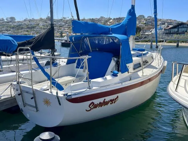 Slide: The Image of 1973 Ericson 27 sailboat Sunburst docked at a marina. - 19