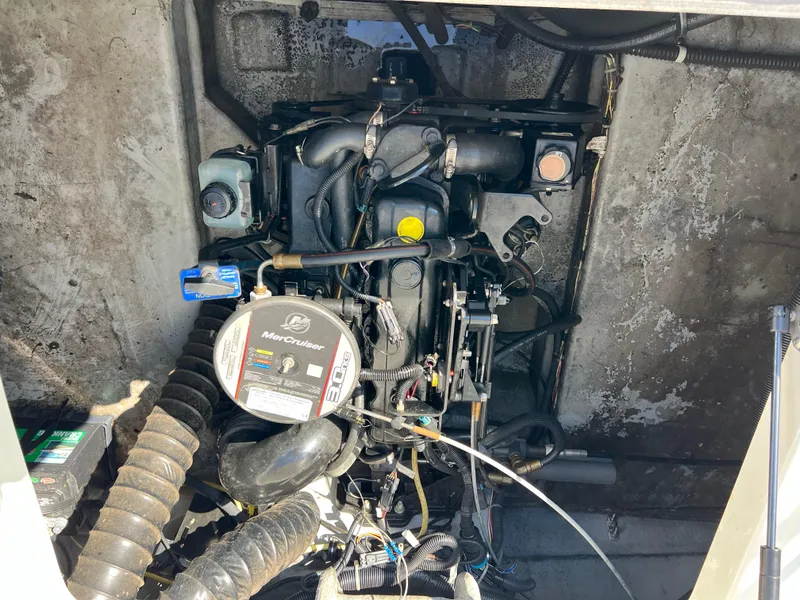 Slide: The Image of 2011 Bayliner 197 boat engine compartment with MerCruiser engine. - 13