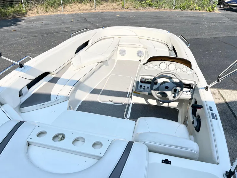 Slide: The Image of 2011 Bayliner 197 boat interior with steering wheel and seating. - 5