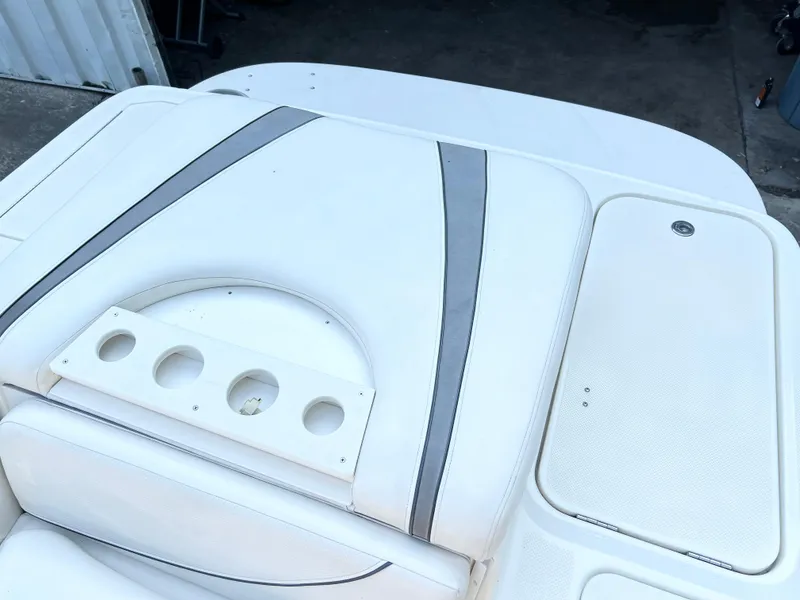Slide: The Image of 2011 Bayliner 197 boat interior with white and gray seating. - 6