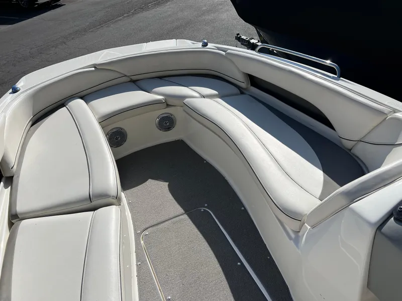 Slide: The Image of 2011 Bayliner 197 boat with spacious, cushioned seating area. - 9