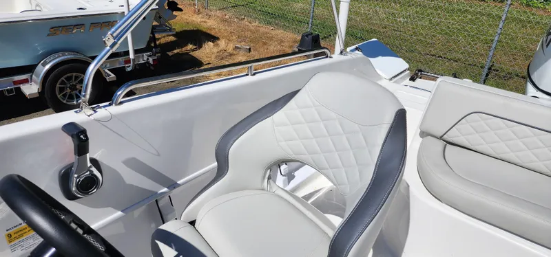 Slide: The Image of 2023 Sea Pro Citation 2100 boat interior with white and gray seating. - 4