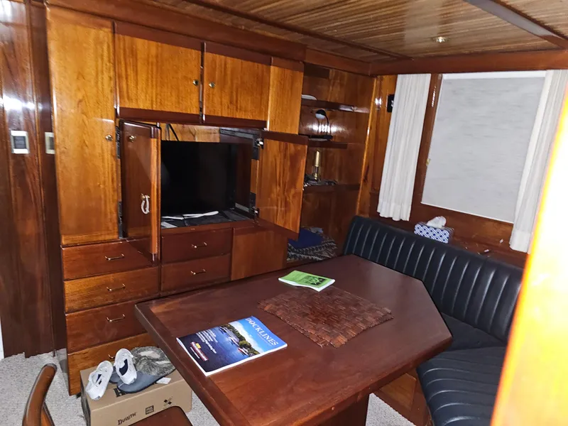 Slide: The Image of Control panel of a 1999 Florida Bay 42 Coaster boat with wooden steering wheel. - 15