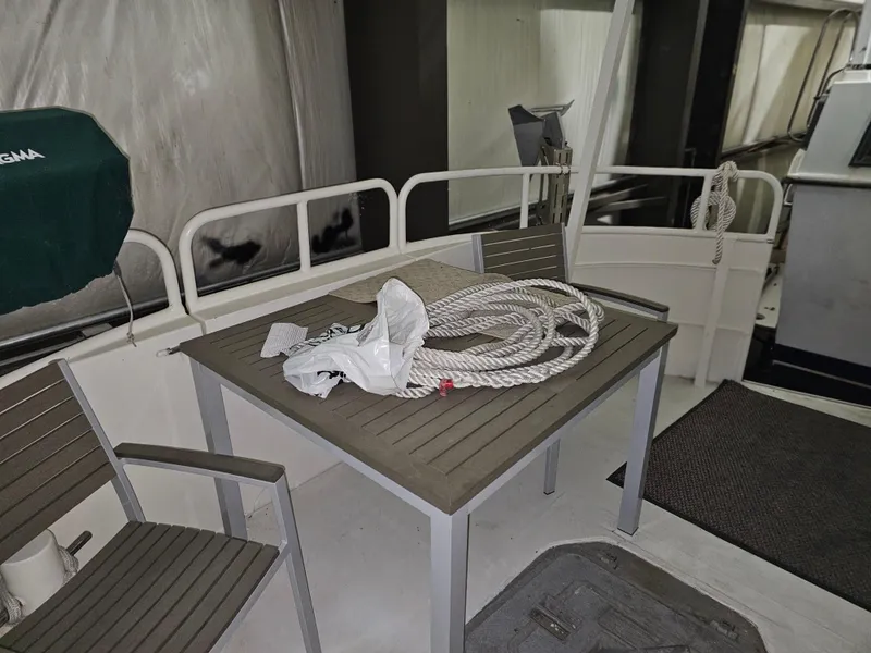 Slide: The Image of Close-up of the propeller and rudder of a 1999 Florida Bay 42 Coaster boat. - 40