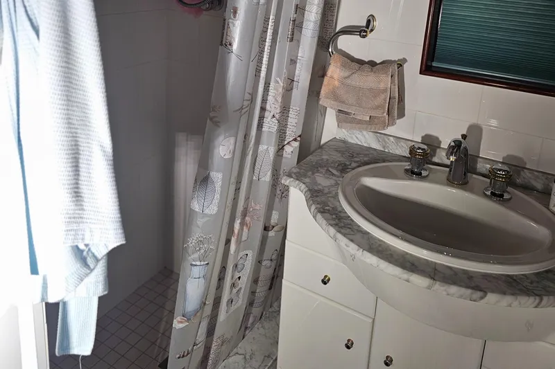 Slide: The Image of Bathroom interior of 1999 Florida Bay Coaster 42 yacht with shower and sink. - 43