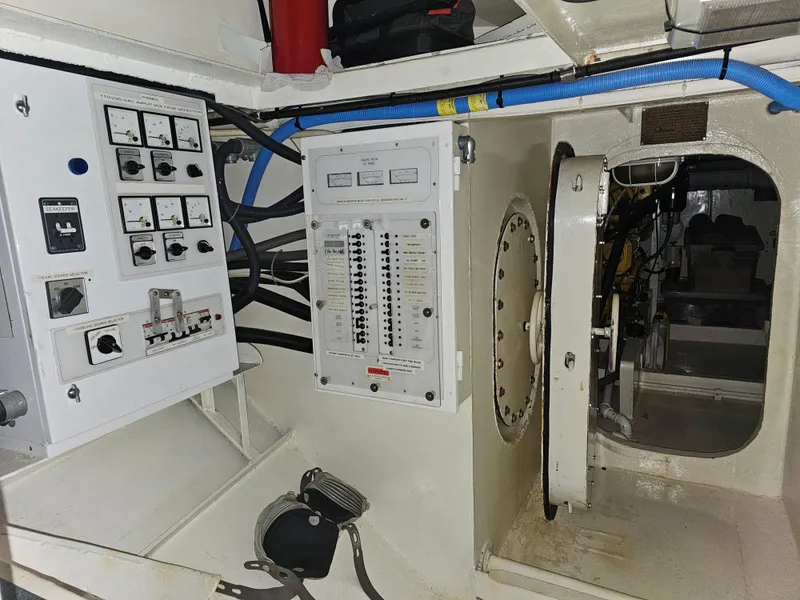 Slide: The Image of Electrical control panel in the engine room of a 1999 Florida Bay 42 Coaster boat. - 59
