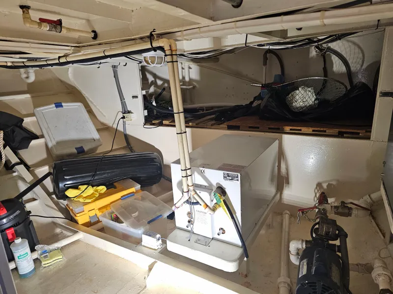 Slide: The Image of Interior of 1999 Florida Bay Coaster 42 boat, showing storage and equipment. - 64