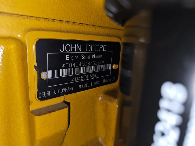 Slide: The Image of John Deere engine serial number plate on a 1999 Florida Bay 42 Coaster. - 65