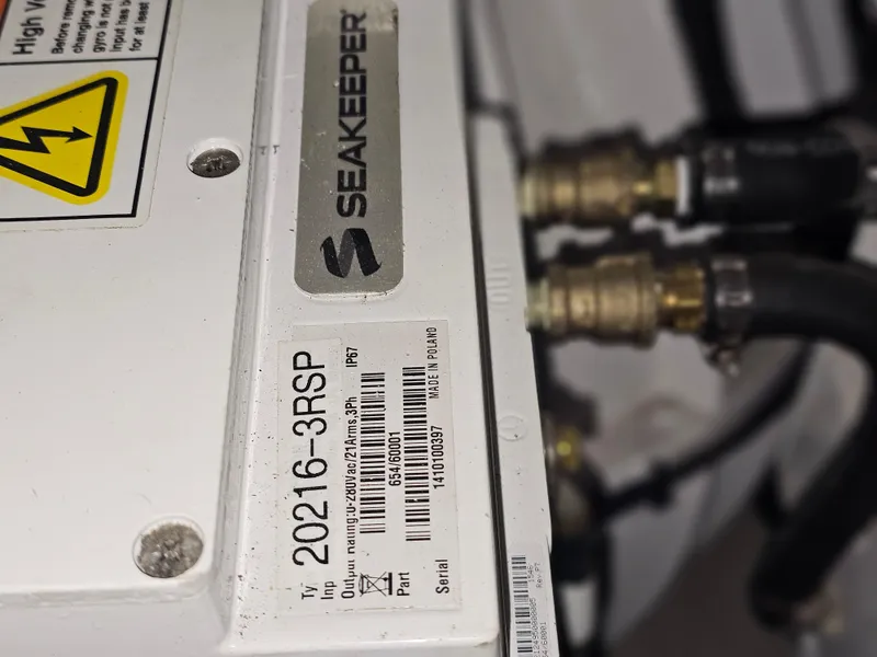 Slide: The Image of 1999 Florida Bay 42 Coaster boat in a maintenance facility. - 9