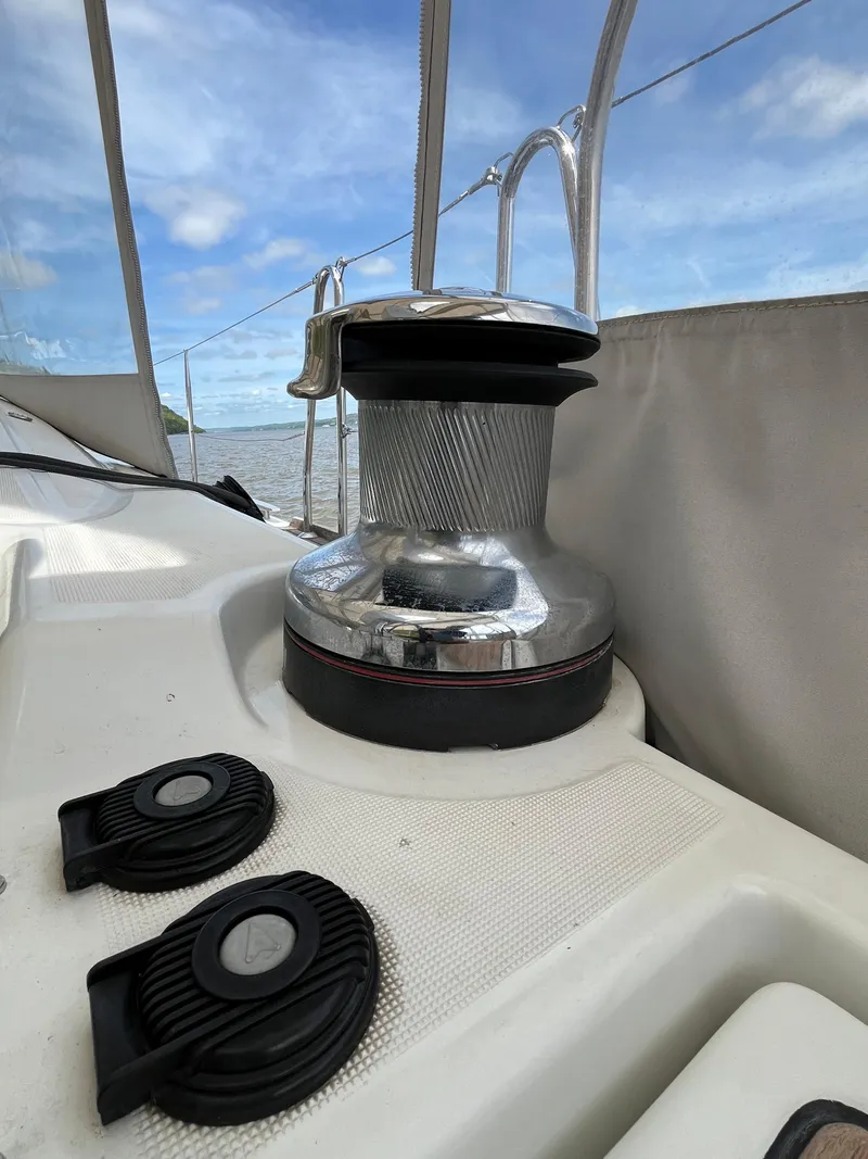 Slide: The Image of Winch on 2012 Beneteau Oceanis 58 sailboat deck under blue sky. - 18