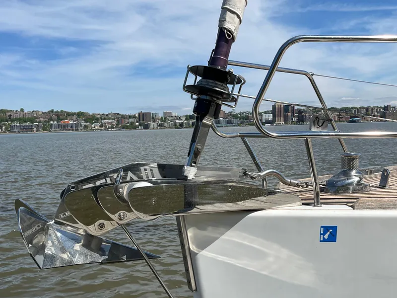 Slide: The Image of Bow of 2012 Beneteau Oceanis 58 yacht with anchor, on calm water. - 31