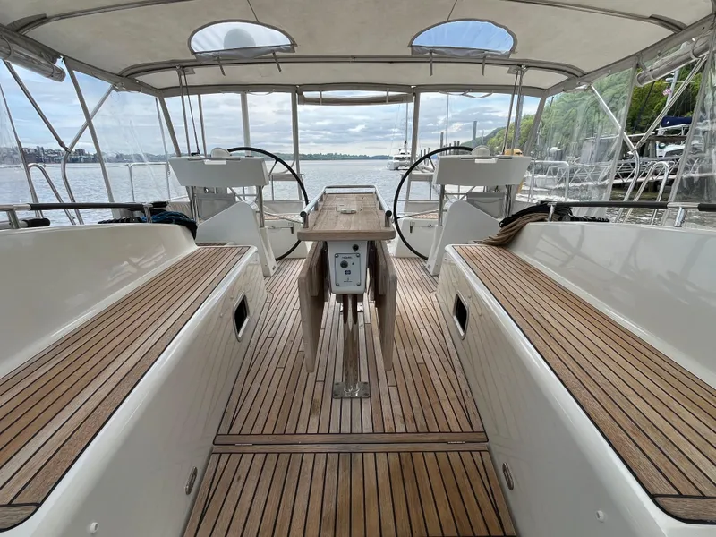 Slide: The Image of Spacious cockpit of 2012 Beneteau Oceanis 58 sailboat with dual steering wheels. - 48