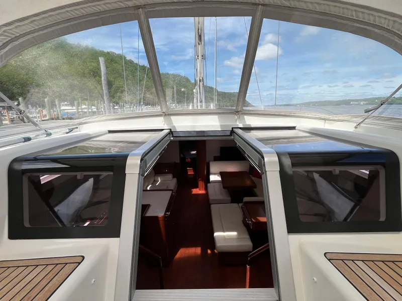 Slide: The Image of Beneteau Oceanis 58 yacht interior, 2012 model, featuring spacious seating and elegant design. - 49