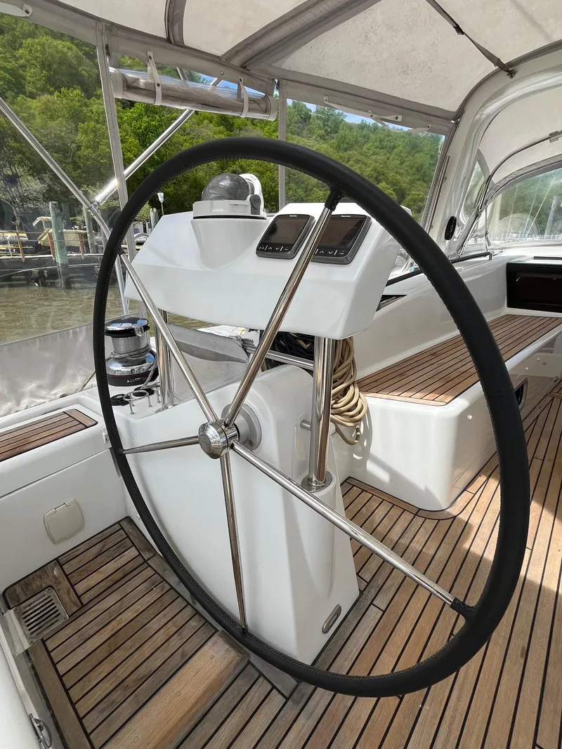 Slide: The Image of Steering wheel of 2012 Beneteau Oceanis 58 yacht with teak deck and navigation instruments. - 5
