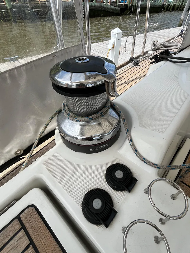 Slide: The Image of Winch on 2012 Beneteau Oceanis 58 sailboat deck, with ropes and fittings. - 7