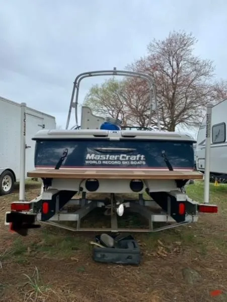 Slide: The Image of 1996 MasterCraft Prostar 205 boat, rear view, parked outdoors. - 11