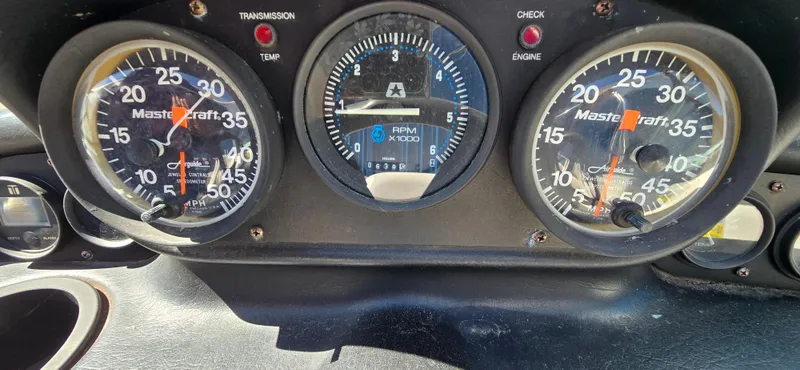 Slide: The Image of Dashboard of a 1996 MasterCraft Prostar 205 boat with gauges and indicators. - 16