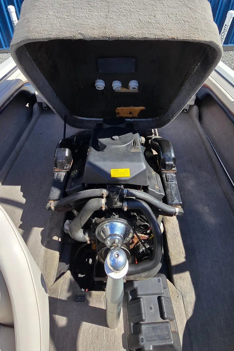 Slide: The Image of 1996 MasterCraft Prostar 205 engine compartment with open cover, showcasing internal components. - 18