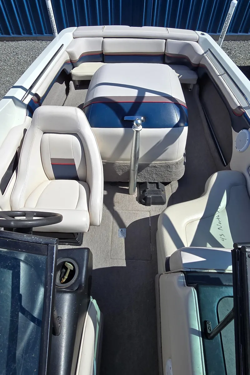 Slide: The Image of 1996 MasterCraft Prostar 205 boat interior with seating and steering wheel. - 23