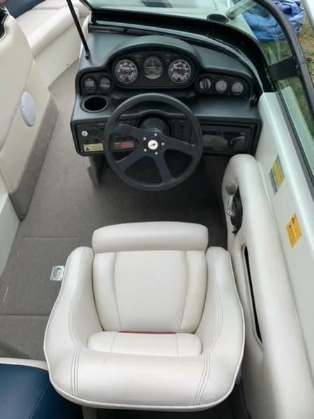 Slide: The Image of 1996 MasterCraft Prostar 205 boat interior, featuring steering wheel and dashboard. - 5