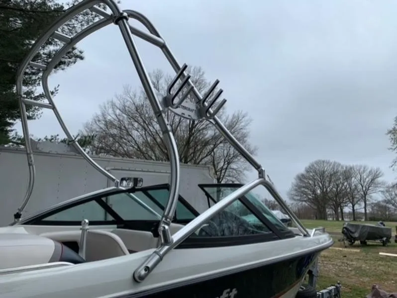 Slide: The Image of 1996 MasterCraft Prostar 205 boat with wakeboard tower in a park setting. - 7