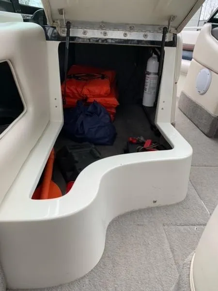 Slide: The Image of Storage compartment of a 1996 MasterCraft Prostar 205 boat with safety equipment. - 8