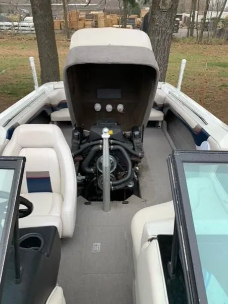 Slide: The Image of 1996 MasterCraft Prostar 205 boat with open engine compartment. - 9
