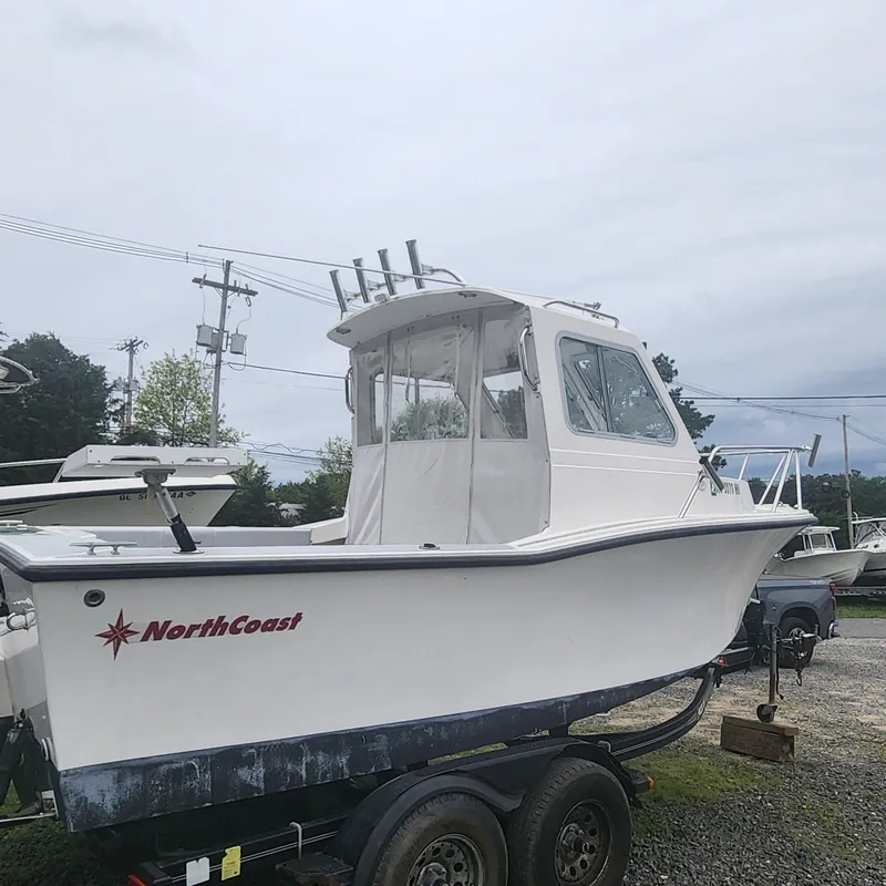 Slide: The Image of 2019 NorthCoast 215 Cabin boat on a trailer, side view. - 14