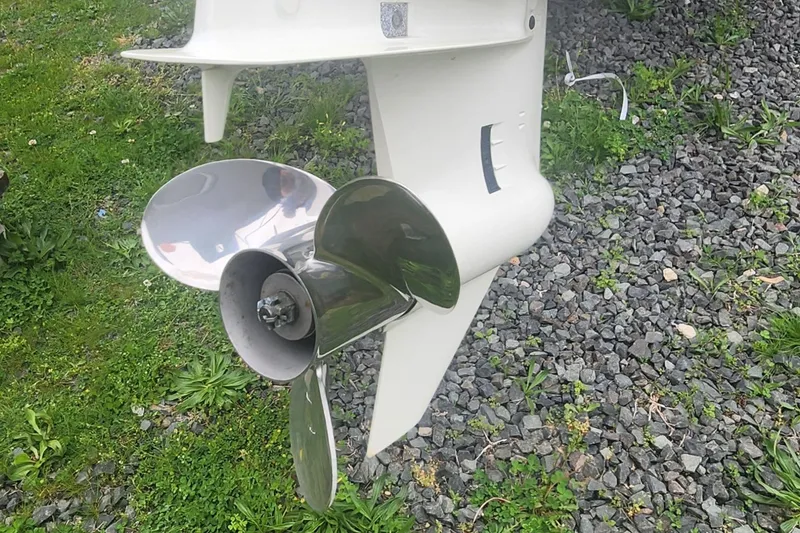 Slide: The Image of 2019 NorthCoast 215 Cabin boat propeller on gravel and grass background. - 16