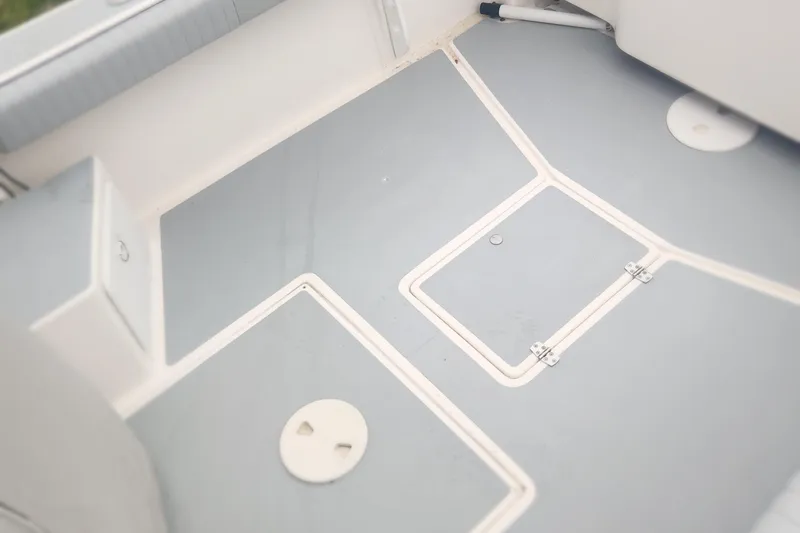 Slide: The Image of 2019 NorthCoast 215 Cabin boat deck with storage compartments. - 19