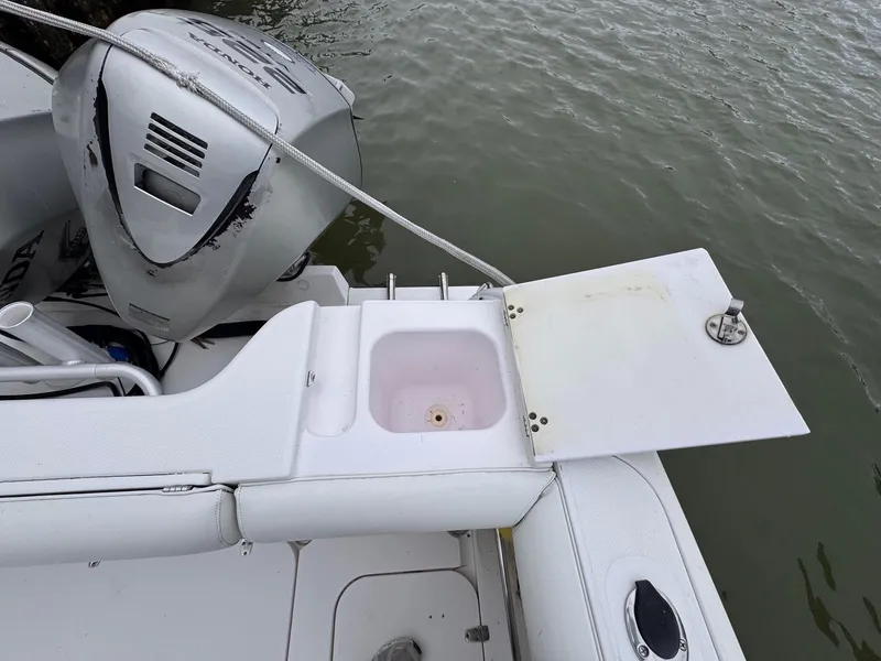 Slide: The Image of 2006 Pro-Line 32 Express boat with motor and sink by the water. - 11