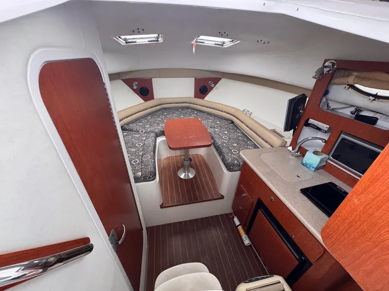 Slide: The Image of 2006 Pro-Line 32 Express cabin interior with kitchenette and seating area. - 14