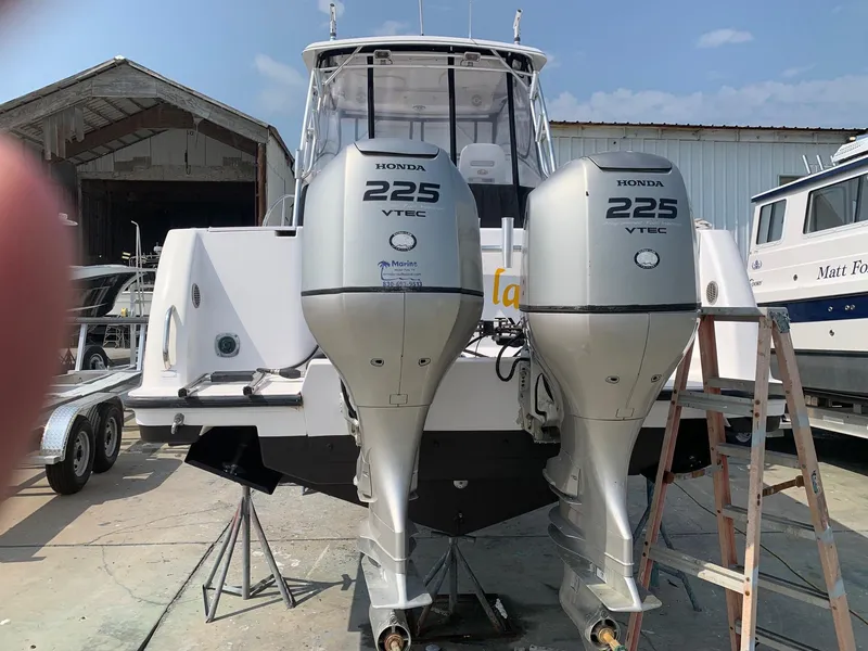 Slide: The Image of 2006 Pro-Line 32 Express boat with twin Honda 225 VTEC outboard engines. - 2