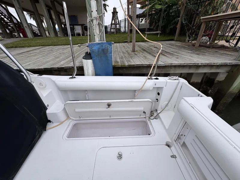 Slide: The Image of 2006 Pro-Line 32 Express boat deck with open storage compartment. - 8