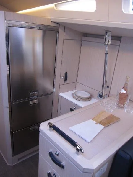 Slide: The Image of Modern kitchen area in 2024 Jeanneau 60 yacht with stainless steel appliances. - 21