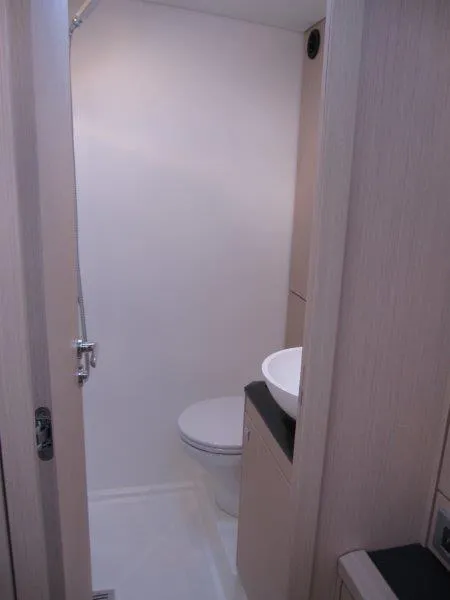 Slide: The Image of 2024 Jeanneau 60 yacht bathroom with modern fixtures and minimalist design. - 36