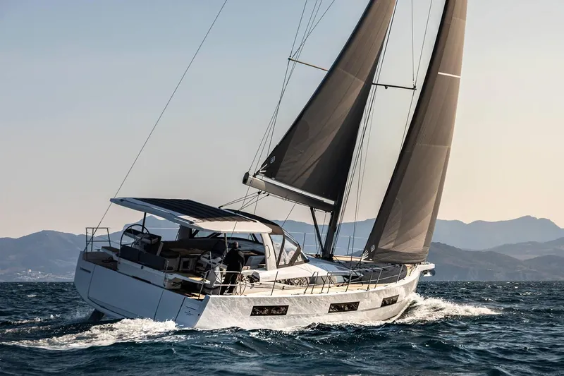 The Image of 2024 Jeanneau 60 sailing yacht cruising on open water. - 0