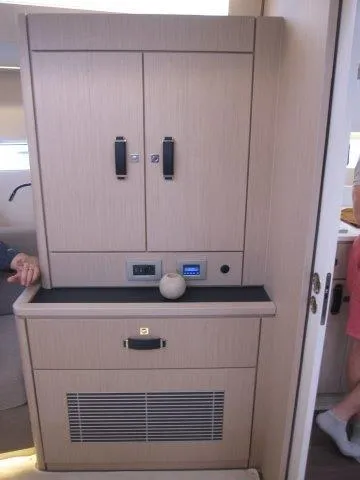 Slide: The Image of Modern interior of 2024 Jeanneau 55 yacht with sleek cabinetry and control panel. - 45