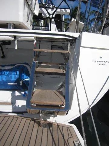 Slide: The Image of 2025 Jeanneau Yacht 65 stern view with boarding ladder. - 15