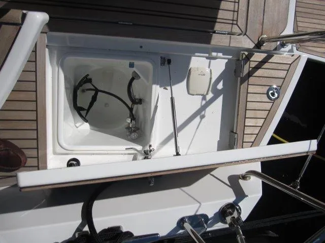 Slide: The Image of Open storage compartment on 2025 Jeanneau Yacht 65 deck. - 35